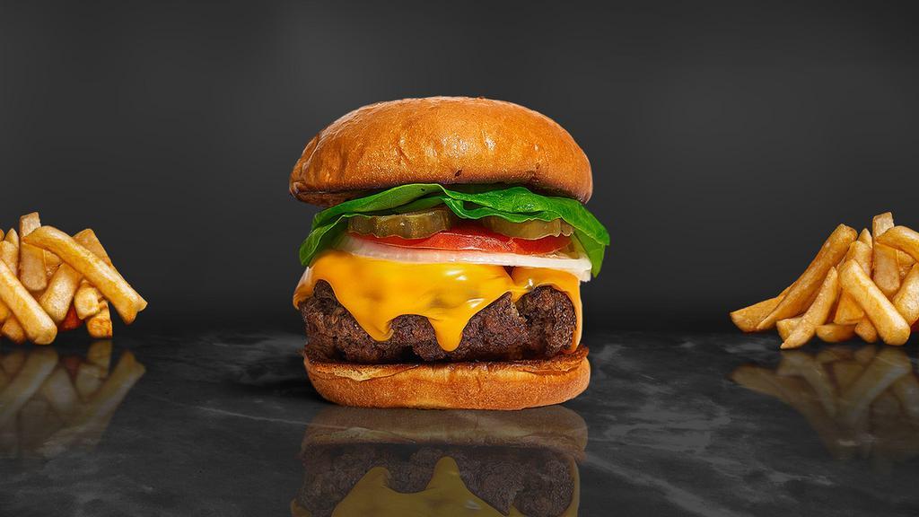 Cheese Tripper Burger · American beef patty topped with American cheese, lettuce, tomato and mayo. Served on a warm bun.
