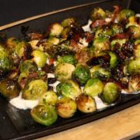 Roasted Brussels Sprouts · Roasted brussels sprouts served with maple-smoked bacon and a garlic aioli.