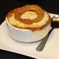 French Onion Soup · Made with sherry wine and topped with buttered croutons and layers of melted Provolone chees...