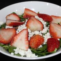 Strawberry And Goat Cheese Salad · Fresh spinach, strawberries, goat cheese and candied pecans tossed in housemade balsamic vin...