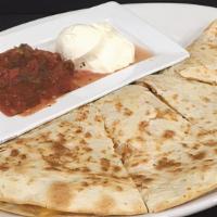 Quesadilla · A grilled tortilla stuffed with cheese, bacon, diced tomatoes, and green onions. Served with...