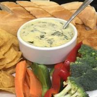 Hot Spinach And Artichoke Dip · A creamy blend of spinach, artichoke hearts, garlic, and mixed cheeses. Served with vegetabl...