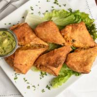 Tex-Mex Eggrolls · Spicy chicken, corn, black beans, peppers, onions, cheese, housemade avocado-ranch dipping s...