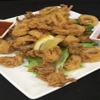 Fried Calamari · Dipped in maggie's signature housemade buttermilk batter then lightly fried. Served with lem...