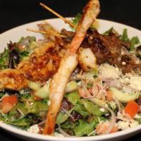 Mixed Grill Salad · Certified Angus Beef® steak, grilled all-natural free-range chicken, and grilled shrimp, mar...