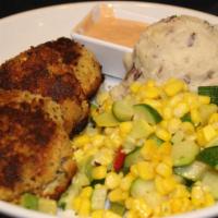 Pan-Seared Crab Cakes · Fresh lump crab meat extra virgin olive oil garlic mashed potatoes roasted sweet corn medley...