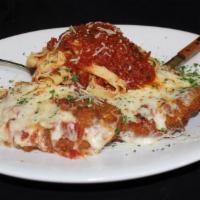 Chicken Parmigiano · All-natural free-range chicken breast coated with a Parmesan cheese and breadcrumb crust bak...