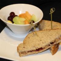 Pb&J Sandwich · Creamy all-natural peanut butter and grape jelly on whole wheat bread. Served with fruit sal...