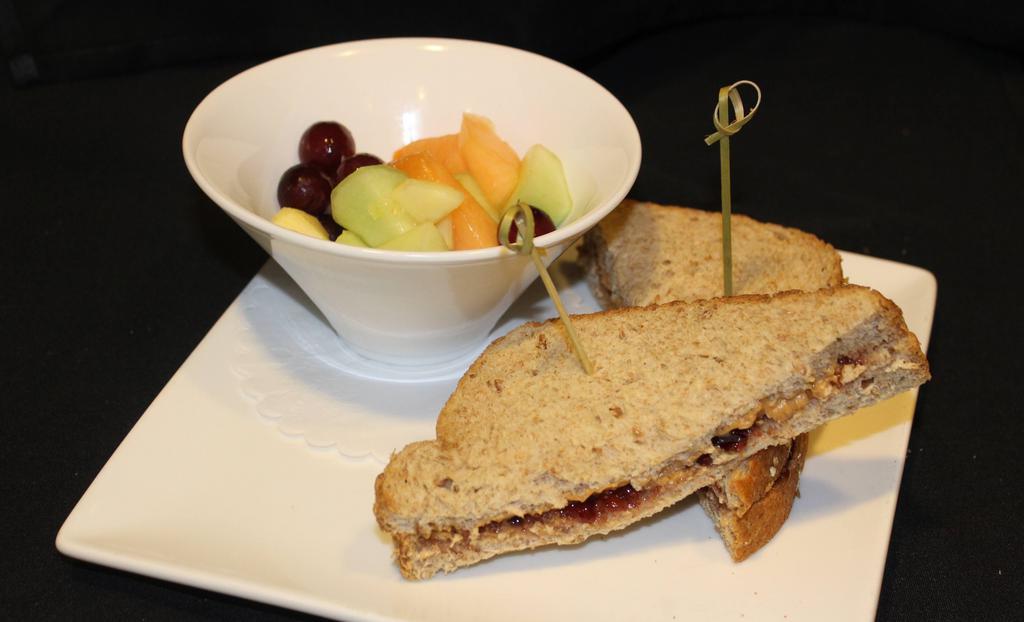Pb&J Sandwich · Creamy all-natural peanut butter and grape jelly on whole wheat bread. Served with fruit salad.