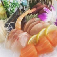 Sashimi Deluxe · 18 pieces of assorted sashimi. Disclaimer: Consuming raw or undercooked meats, poultry, seaf...