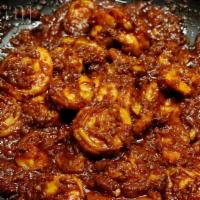 Shrimp Bhuna Roast · Pan fried shrimp cooked with fresh herbs and spices.