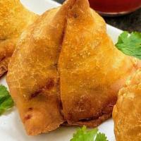 Samosas Sorcerer · Crispy turnovers with seasoned potatoes green peas, and spices.