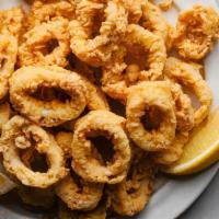 Fried Calamari Cavalry · Chickpea battered rings of squid. Served with house chutney.