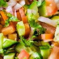 Indian Salad Tossed  · Diced cucumbers, onions, tomatoes, chickpeas, green chili, and freshly squeezed lime juice. ...