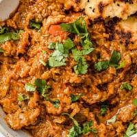 Baingan Bharta Popular · Eggplant cooked in oven, and mashed, sauteed with onion, and tomato.