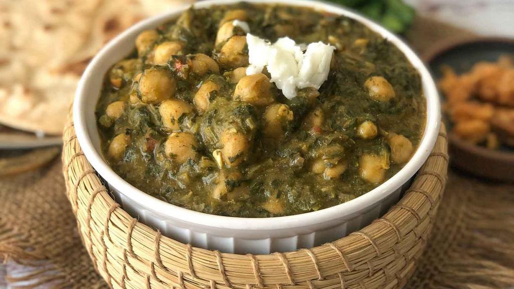 Channa Saag · Chickpeas cooked with fresh spinach.