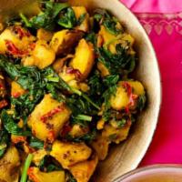 Saag Aloo Saagwala · Potatoes, spinach cooked together with spiced, and tomatoes.