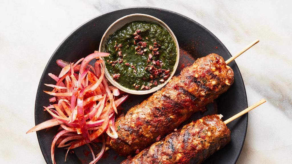 Seekh Kebab Shish · Minced lamb seasoned with Indian herbs rolled on a skewer and broiled in clay oven.