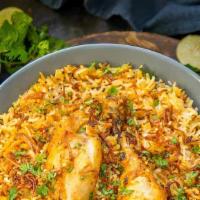 Chicken Biryani Hyderabadi · Basmati rice with tender slices of juicy chicken and mind spices. Served with raita.