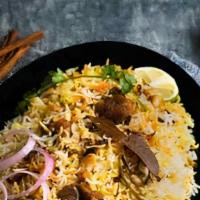 Goat Biryani Hyderabadi · Basmati rice with goat cooked with herbs and spiced. Served with raita.