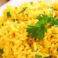 Yellow Rice · Lemon flavored basmati rice with curry leaves and mustard seeds.