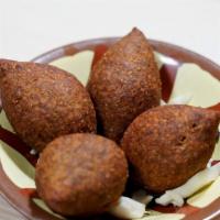 Kibbeh Balls · Meat shell stuffed with chopped meat and pine nut.