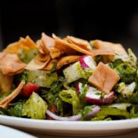 Fattoush Herb Salad · Tomatoes, cucumber, lettuce, and toasted bread.