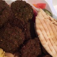 Falafel Plate · With salad, hummus, pita bread and tahini sauce with fries.