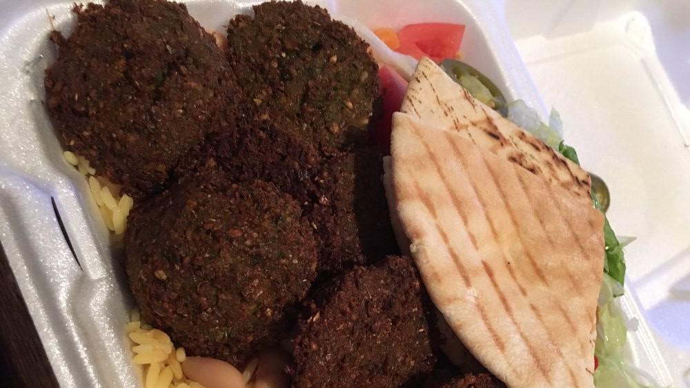 Falafel Plate · With salad, hummus, pita bread and tahini sauce with fries.