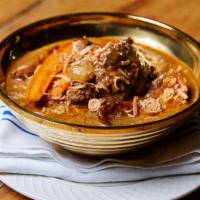 Lamb Massaman · Braised lamb with homemade massamun curry, fingering potato, pearl onion, roasted carrot and...