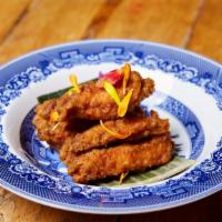 Ko-Rae Chicken Wings · Marinated fried chicken wings with Southern Thai sauce.