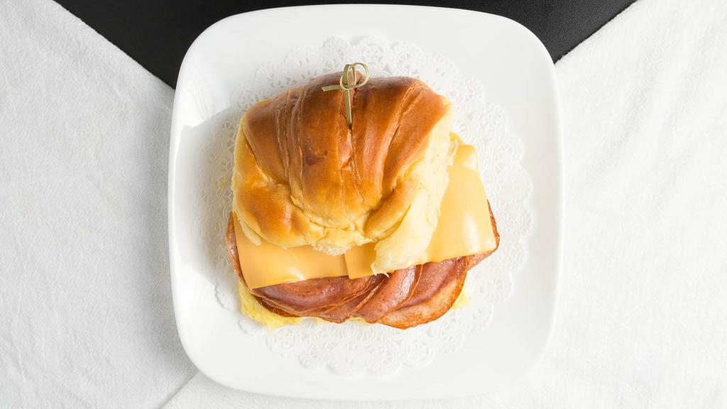 Taylor Ham Egg & Cheese · Portuguese bread with taylor ham, two eggs and American yellow cheese.