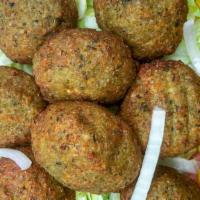 Falafel Over Rice · Served with lettuce and tomato