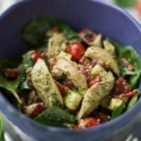 Pesto Chicken Salad · Mesclun mix, pesto chicken, avocado, egg whites, sliced tomatoes, toasted almonds and balsam...