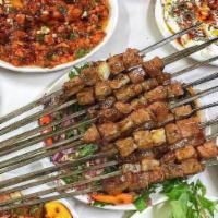 Chop Shish (Shish Kebab) · Cubes of beef comes with rice and salad.