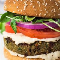 Vegan Burger · Falafel with fresh onion, lettuce, tomato, pickle and Tahini Sauce.