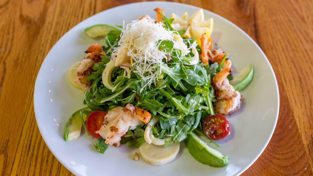 Shrimp Garga Salad · Grilled shrimp, baby arugula, grape tomatoes, red onion, hearts of palm, avocado, lemon vinaigrette, and parmigiana.