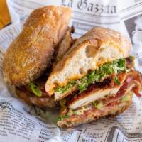 Matteo’S Club · Breaded chicken cutlet bacon, avocado, red onion, lettuce, tomato, and chipotle mayo on ciab...