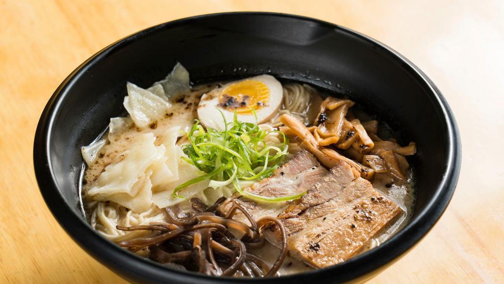 Tonkotsu Ramen · Rich, creamy, 12-hour pork bone broth with braised pork belly, bamboo shoot, egg, wood ear, sauteed cabbage, and scallions.