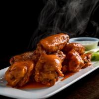 Buffalo Wings · Chicken wings tossed with our spicy Buffalo sauce, JACK DANIELS, BBQ sauce, sweet chili and ...