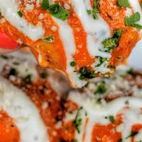 Buffalo Garlic Knots · 3 piece garlic knots tossed in our delicious buffalo sauce topped with ranch dressing
Tomato...