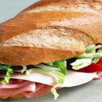 Italian Deluxe · Provolone cheese ham. copicole, genoa salami, pepperoni lettuce, tomato hot peppers oil and ...