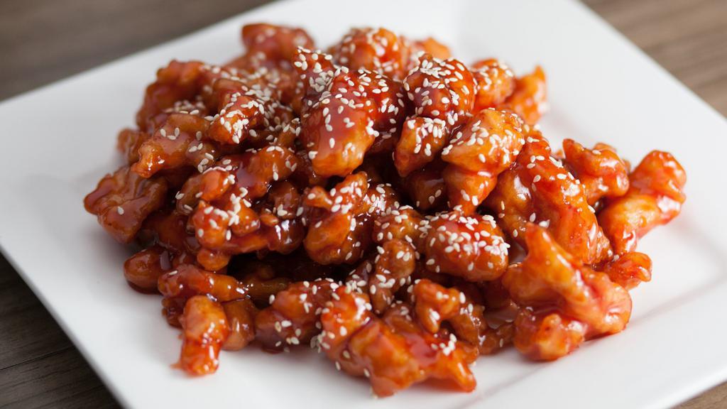 Sesame Chicken · Hot and spicy. Slightly fried chunks of chicken in a heavily blended brown sauce. Served with your choice of rice.