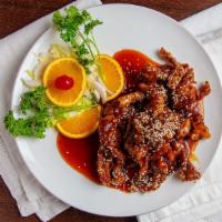Sesame Beef · Hot and spicy.  Deep-fried chunk beef seasoned with orange peels and surrounded with broccol...