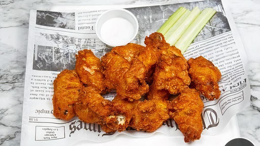 Authentic Signature Wings · Our traditional, spicy battered bone-in wings, fried and hand-tossed in our signature sauces. Served with fresh-cut celery sticks, the ranch served with fresh-cut celery sticks, and ranch.