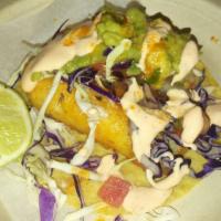 Pescado · Baja style battered fish, slaw, chipotle crema & pico de gallo.