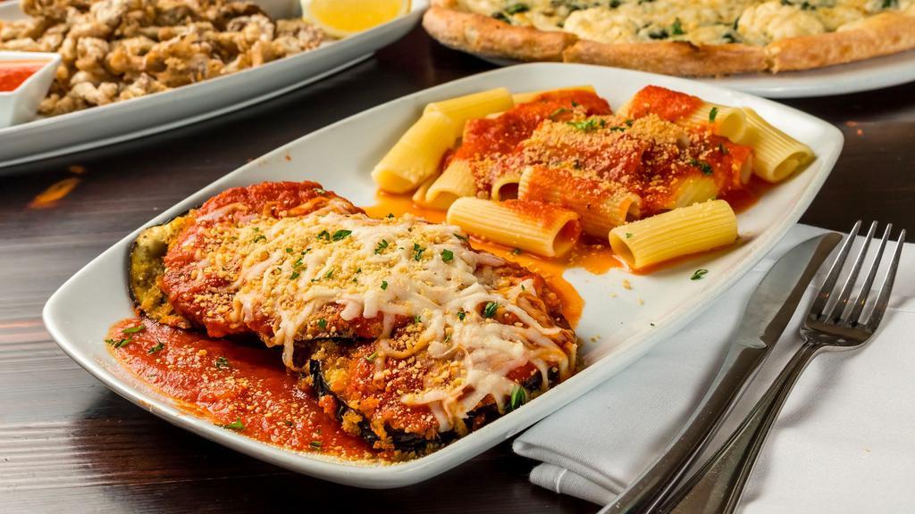Vegan Eggplant Parmesan Dinner · Breaded Eggplant Topped with Tomato Sauce and Cashew Mozzarella Served With Choice of Pasta or Salad.