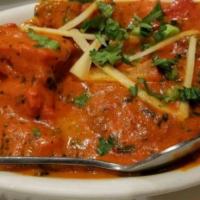 Chicken Tikka Masala · Chunks of chicken breast roast in a clay oven and then cooked in light creamy tomato sauce.