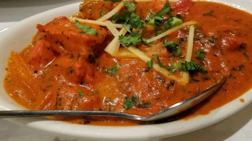 Chicken Tikka Masala · Chunks of chicken breast roast in a clay oven and then cooked in light creamy tomato sauce.