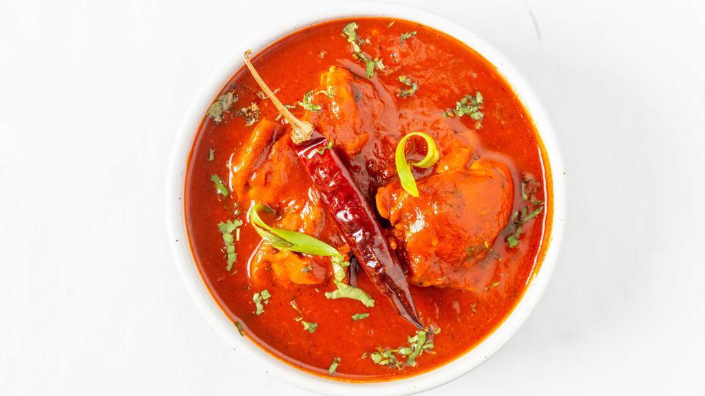 Chicken Vindaloo · Chicken cooked with potatoes in a hot tangy sauce.